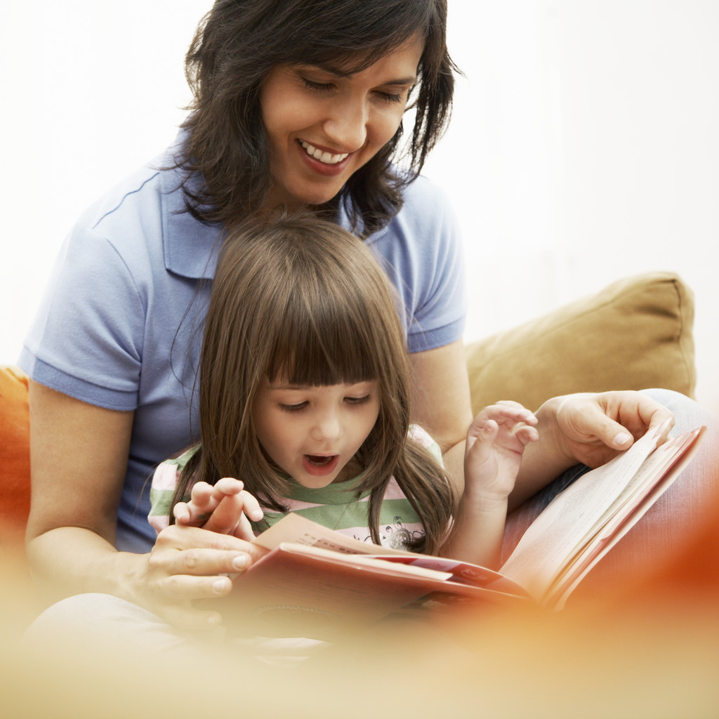 Children Reading Books With Parents