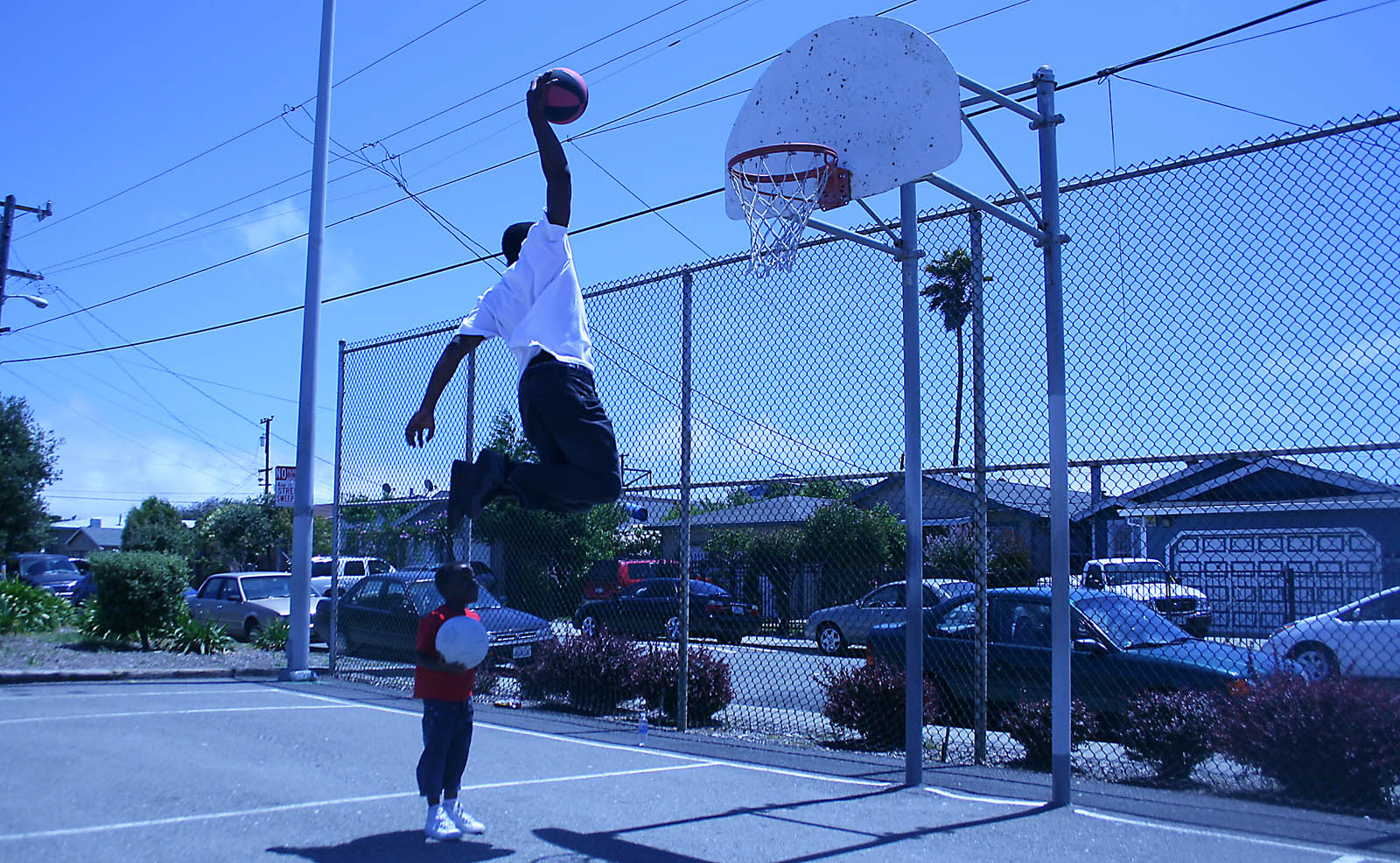 Kid Dunking Basketball